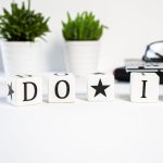 Inspiring office scene with 'Do It' blocks and plants, perfect for motivation.